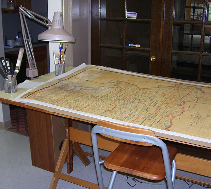 map on a restoration bench in ACA Paper Restoration studio