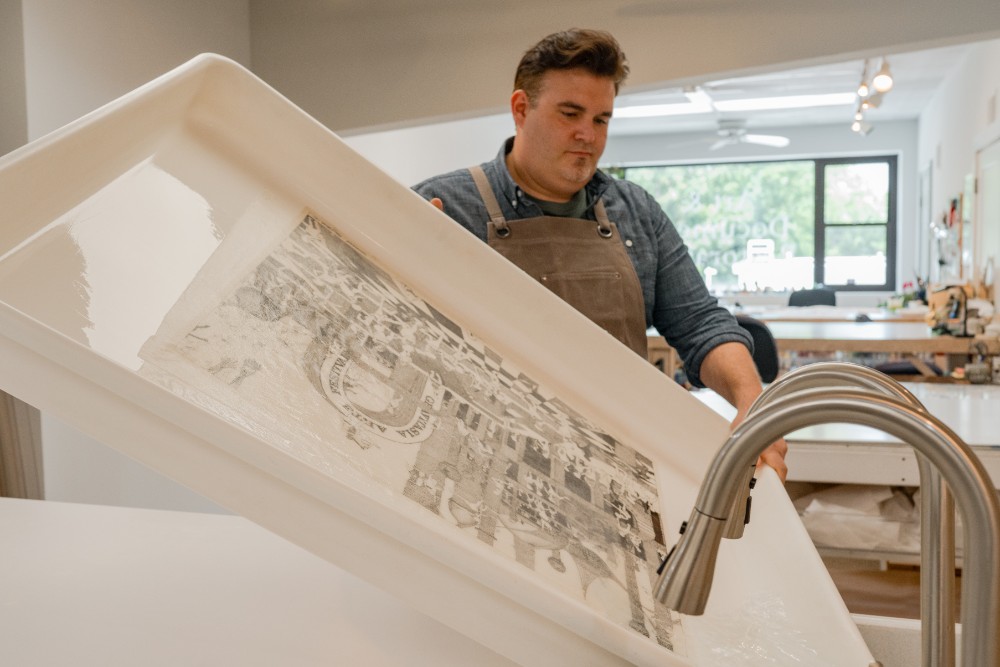 ACA Paper Restoration employee restoring an art print